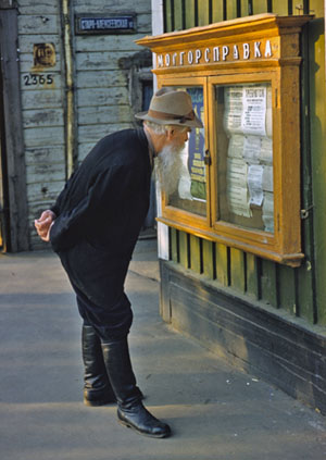 Soviet Citizen reading the Newspaper